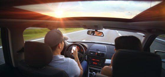 Driving on a highway at sunset