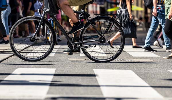 Pedestrians and Bike Crossing at Crosswalk